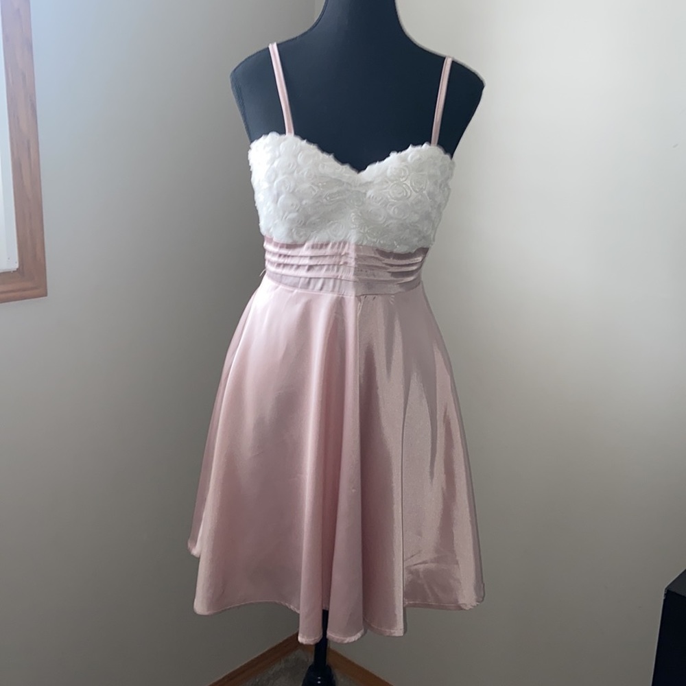 never worn. Small pink mini dress.